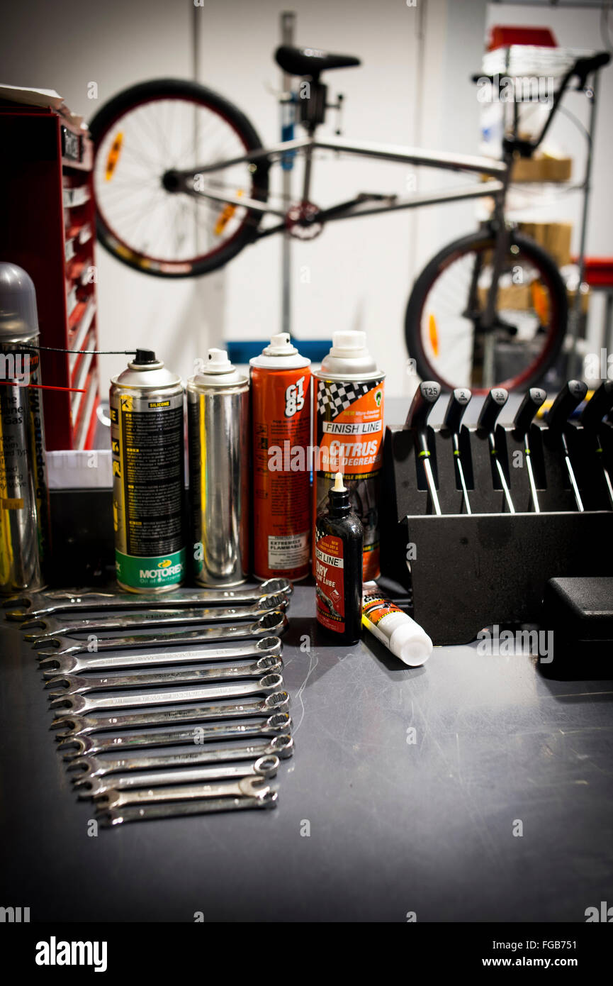 BMX bike on repair stand in a bike shop with tools on a table Stock Photo -  Alamy