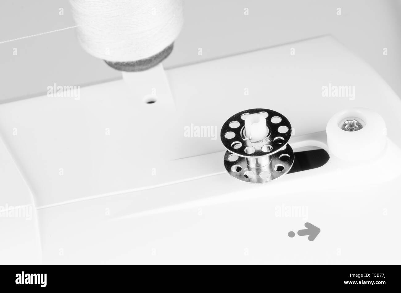 Sewing machine bobbin Black and White Stock Photos & Images - Alamy