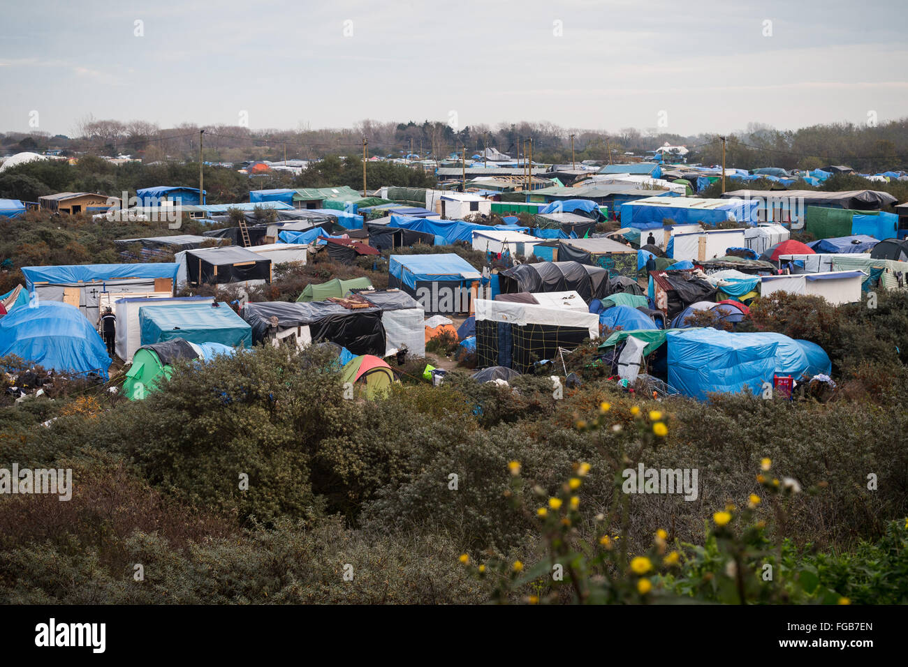 Overlooking the multitude of makeshift shelters in the Calais Refugee Camp, the Jungle, Calais, France Stock Photo