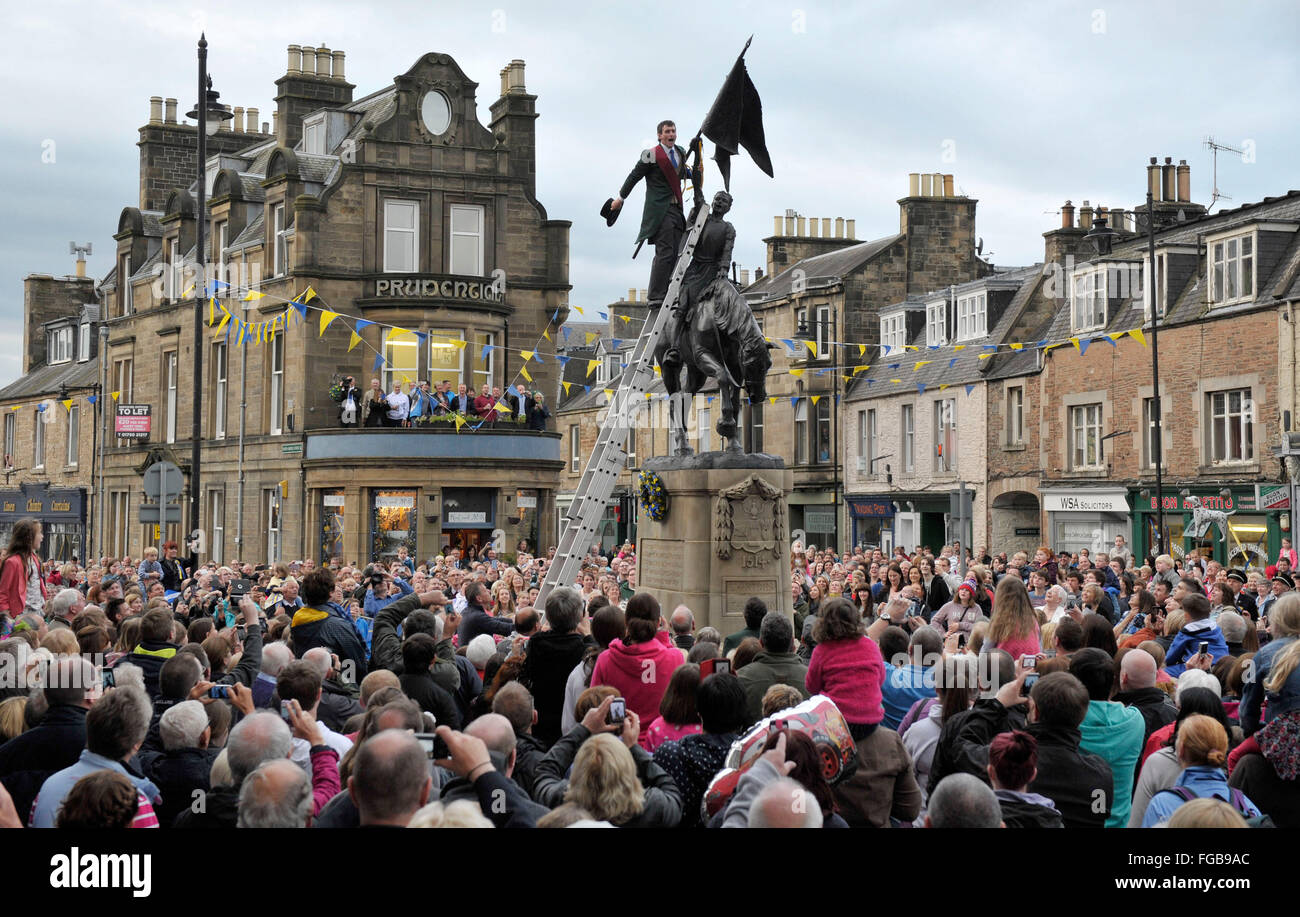 05/06/14, Hawick Common Riding 2014, 500th anniversary of the event. Cornet, Ross Gibson gives three cheers at the Horse statue. Stock Photo