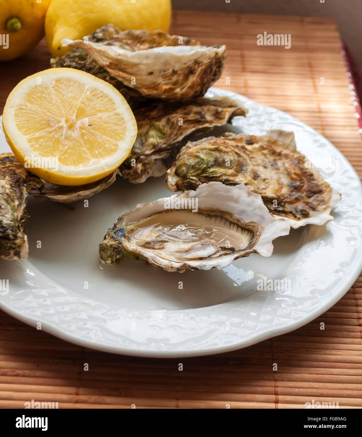 stunning French clams, opened, with a slice of lemon Stock Photo Alamy