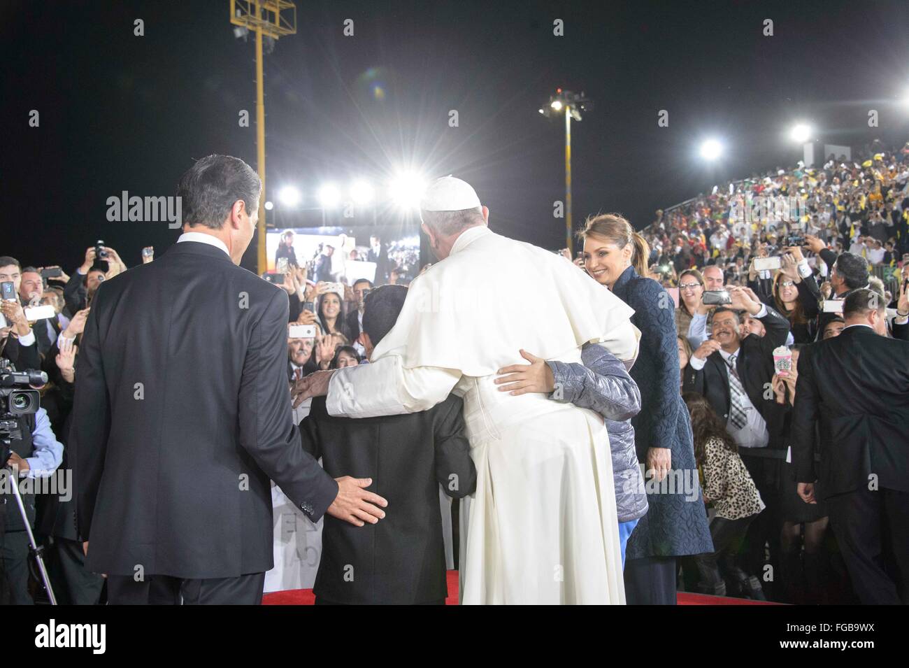 Pope Francis with Mexican President Enrique Pena Nieto and first lady Angelica Rivera stand for a photo with children during the departure ceremony at Gonzalez Airport following a five-day visit to Mexico February 17, 2016 in Ciudad Juarez, Mexico. Stock Photo