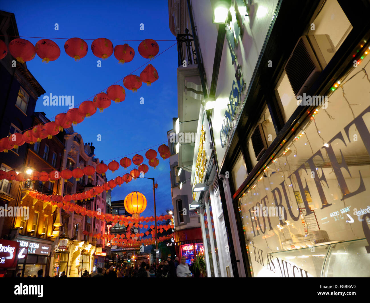 CHINESE BUFFET SIGN red traditional Chinese lanterns and typical Chinese buffet window in foreground Chinatown Soho London UK Stock Photo