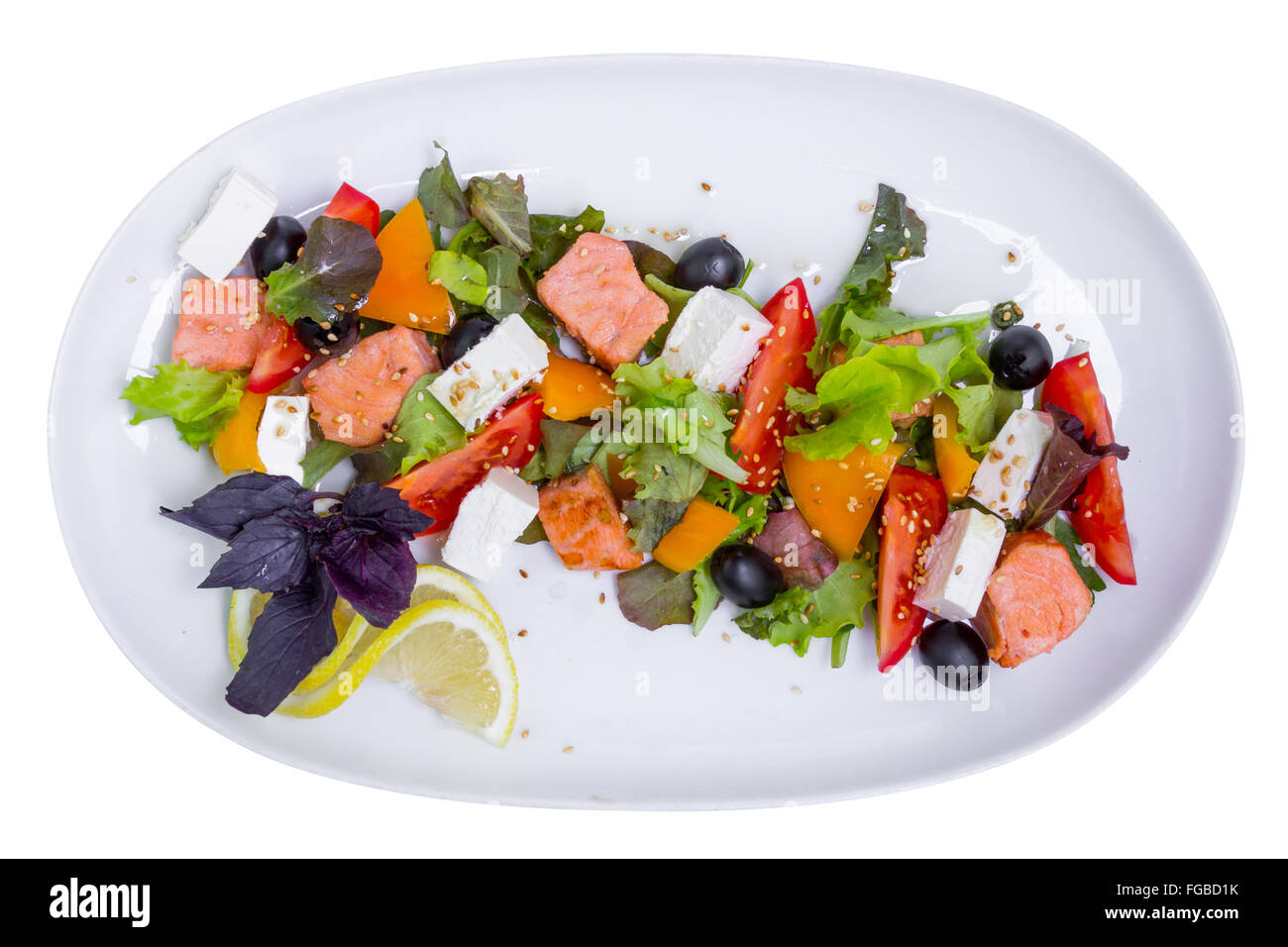 Salmon salad with feta cheese on white long plate, top view, isolated Stock Photo