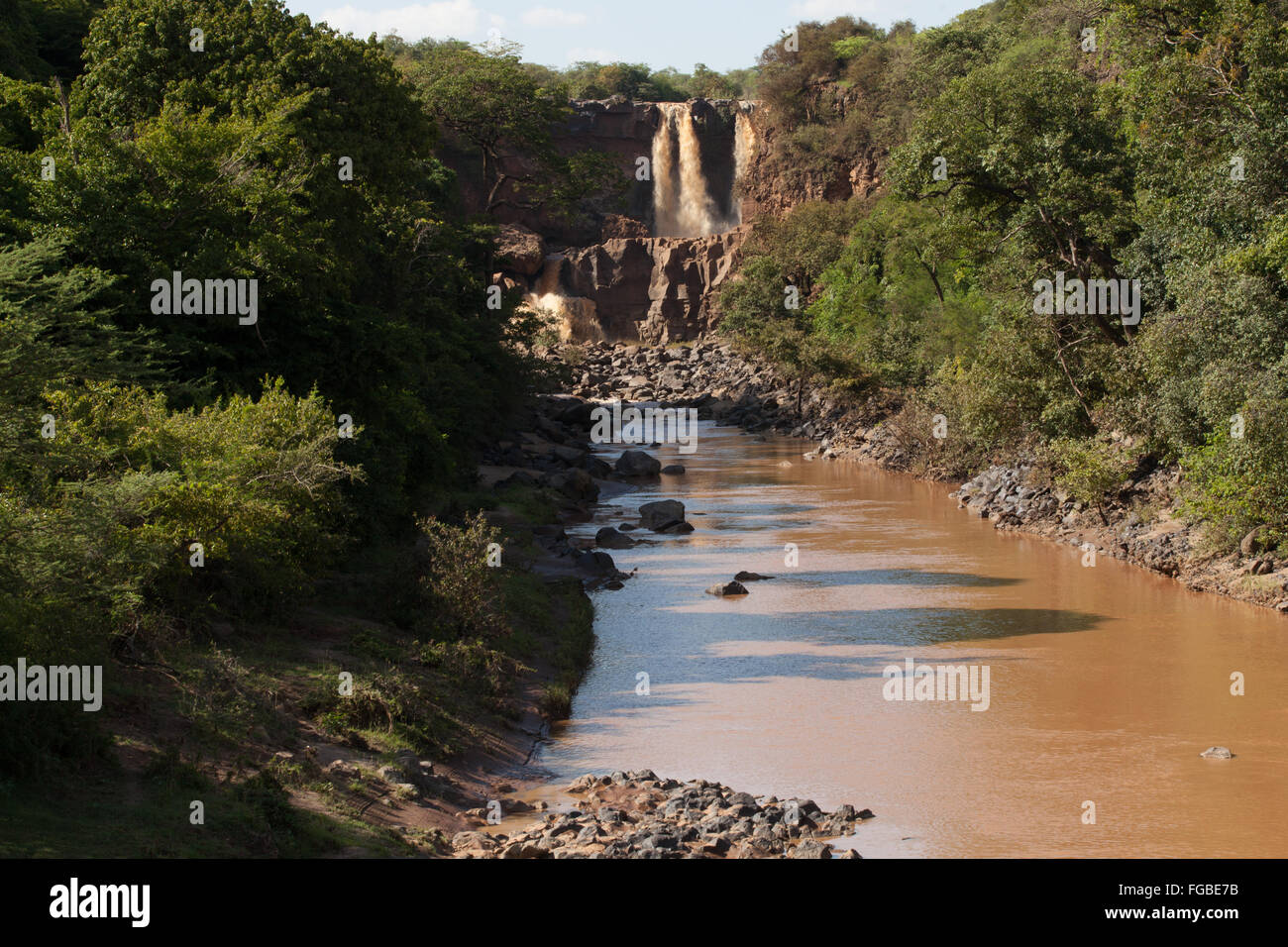 A view of a waterfall cascading into a river, Ethiopia Africa Stock Photo