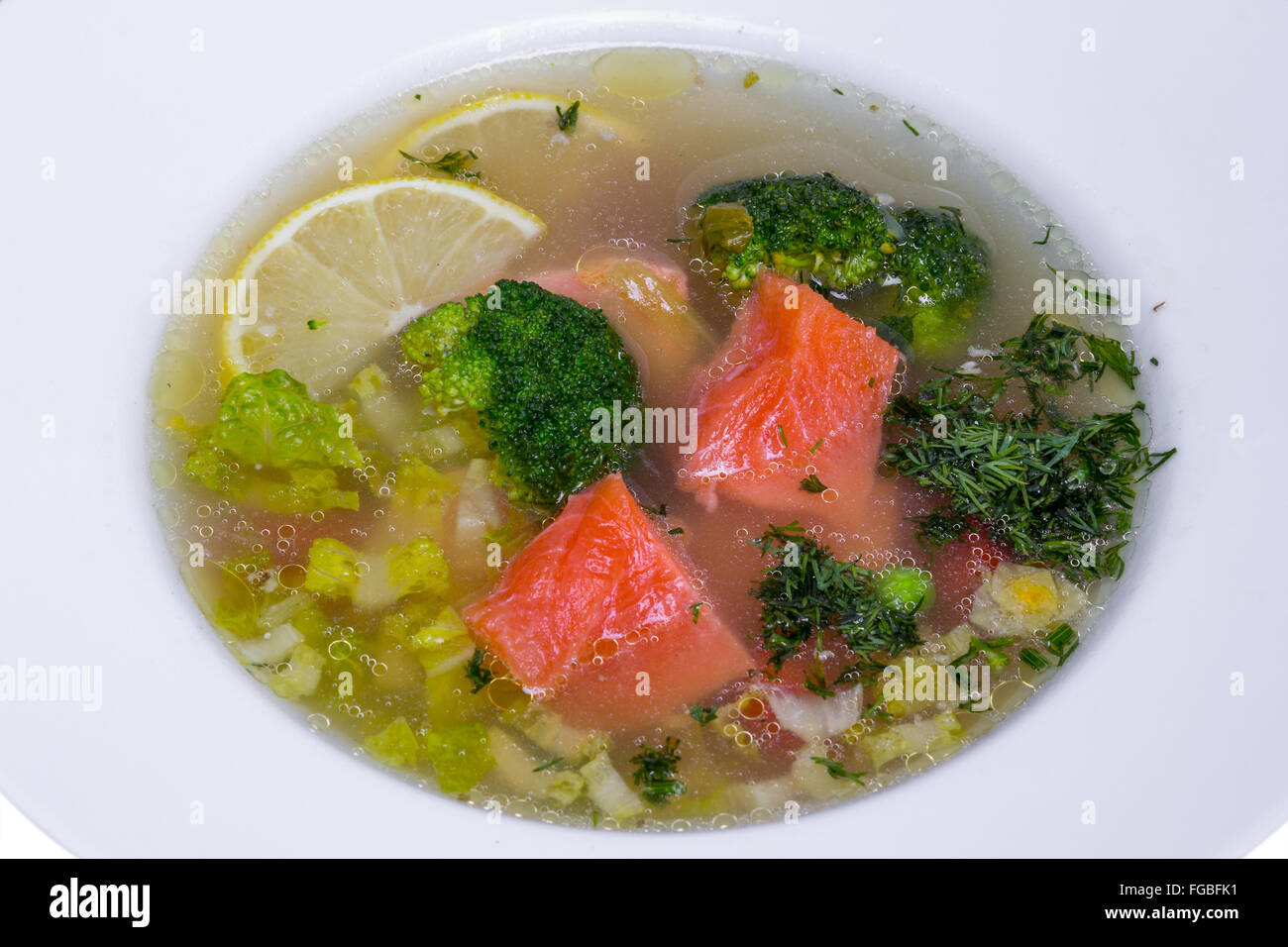 Fish soup with salmon and broccoli in white plate Stock Photo Alamy