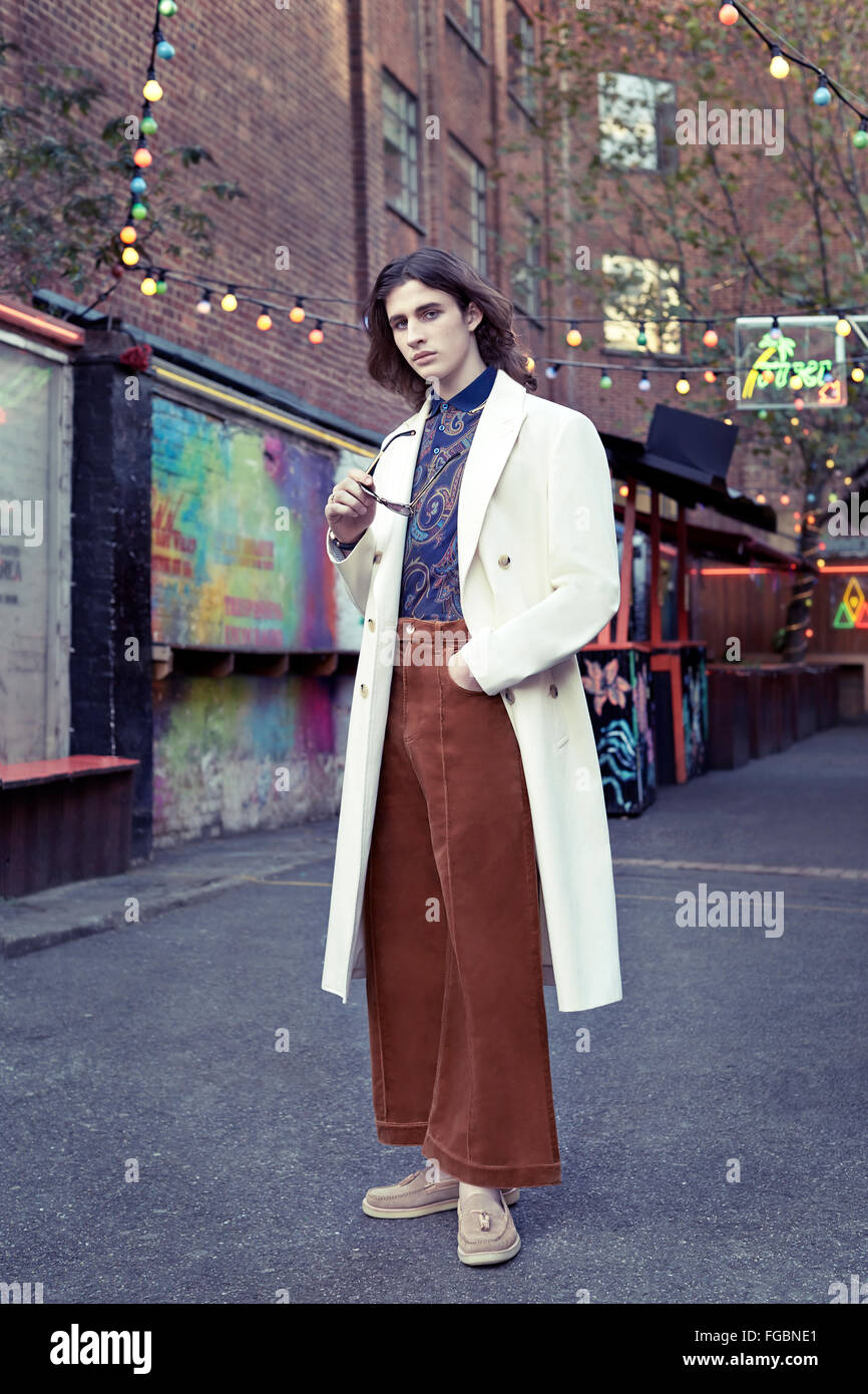 Man dressing in seventies clothes in Shoreditch Stock Photo