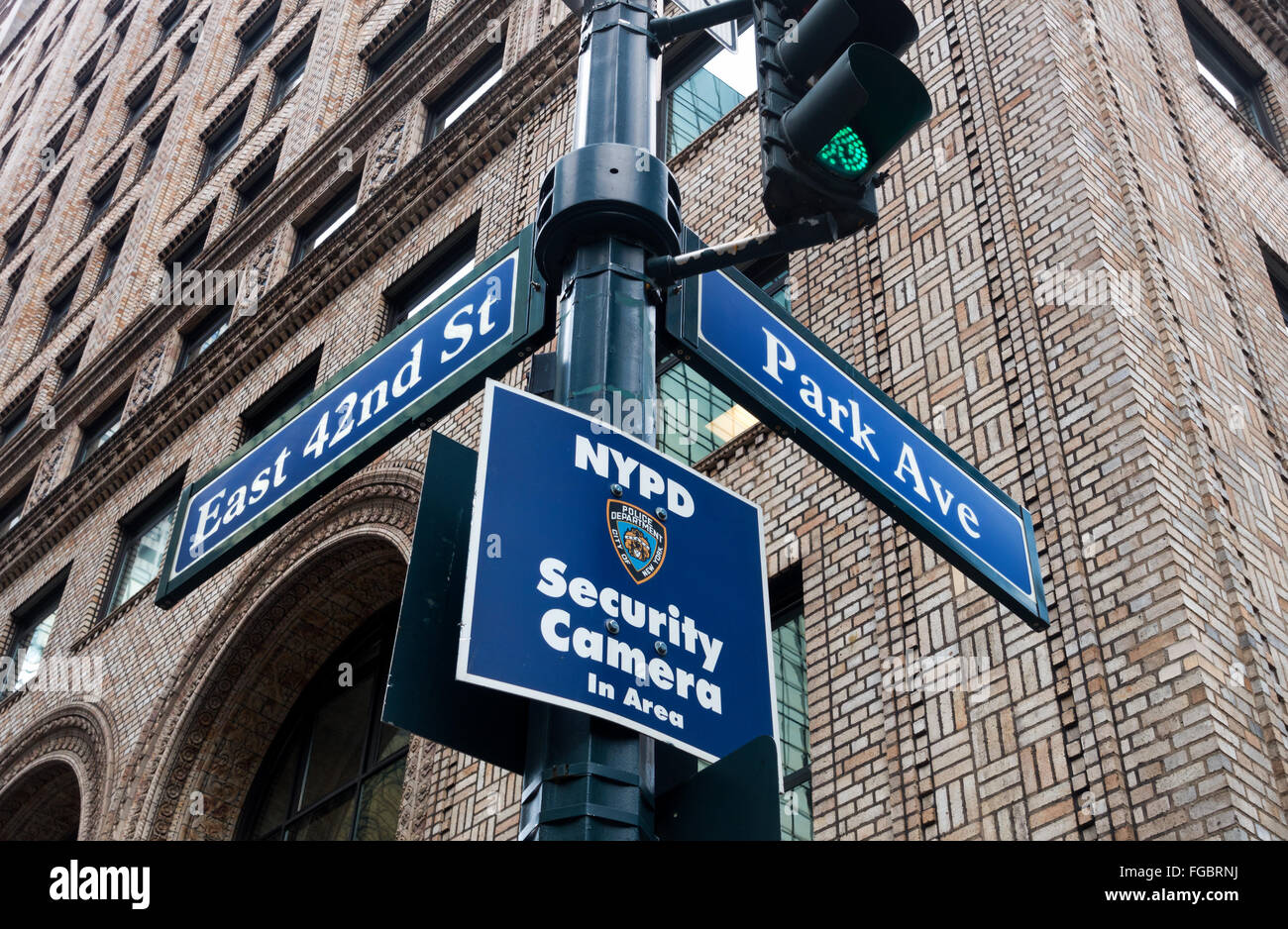 Street signs and NYPD security Camera notice at 42nd Street and Park Avenue in New York City Stock Photo