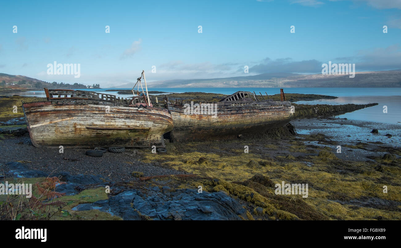 Shipwrecks On Beach Against Sky Stock Photo