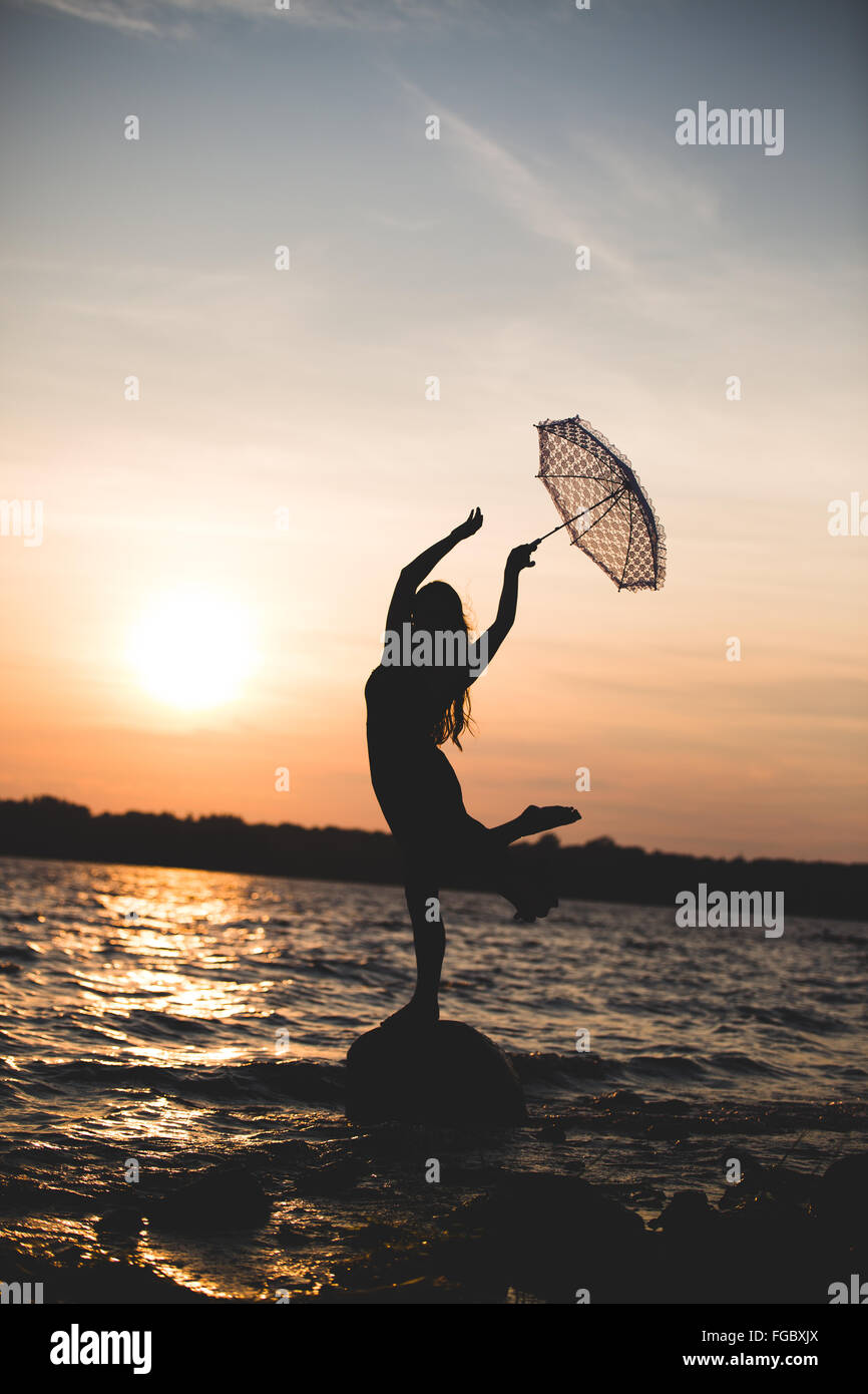 Silhouette Dancing Woman Holding Umbrella High Resolution Stock ... Dancing With Umbrella Silhouette