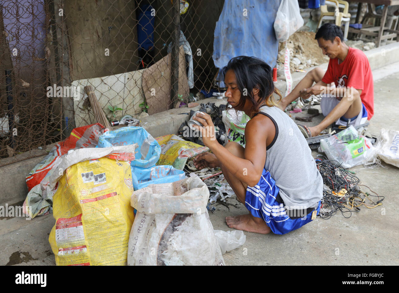 Waste separation and resale in a Junk Shop near the Quezon City Integrated Waste Disposal Facility at Barangay (village) Payatas in Quezon City, Metro Manila, The Philippines Stock Photo