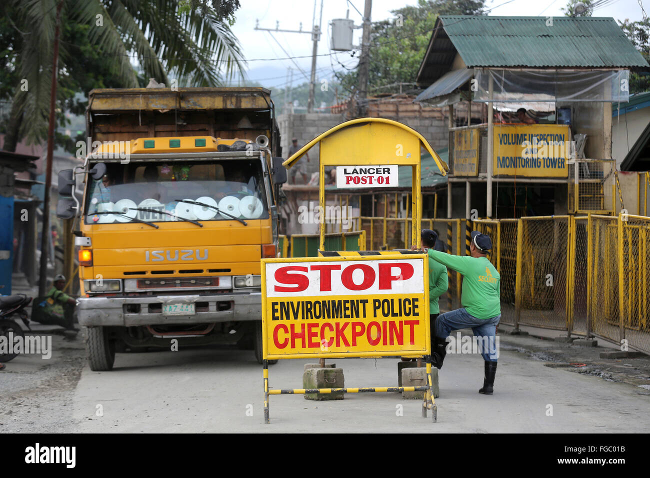 Garbage trucks at the entrance to Payatas garbage landfill, dump site Quezon City "Integrated