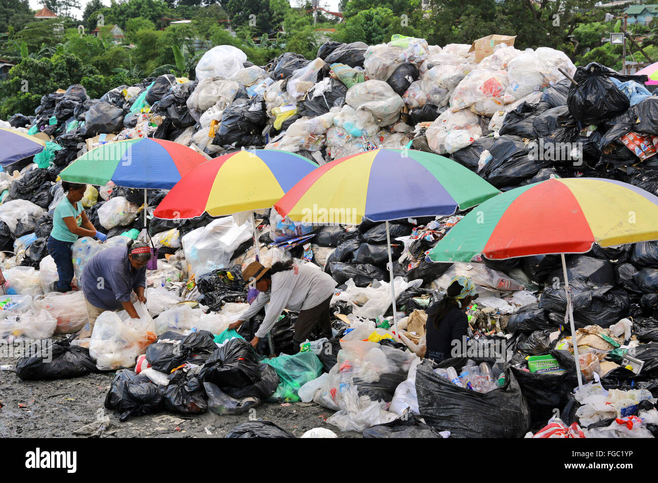 Women work in a waste separation and resale in a Junk Shop near the