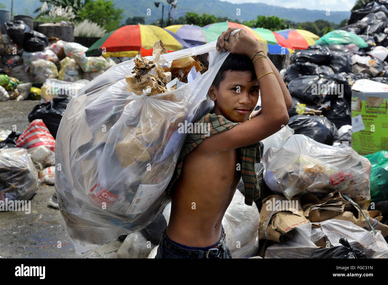 Collecting garbage manila philippines hires stock photography and