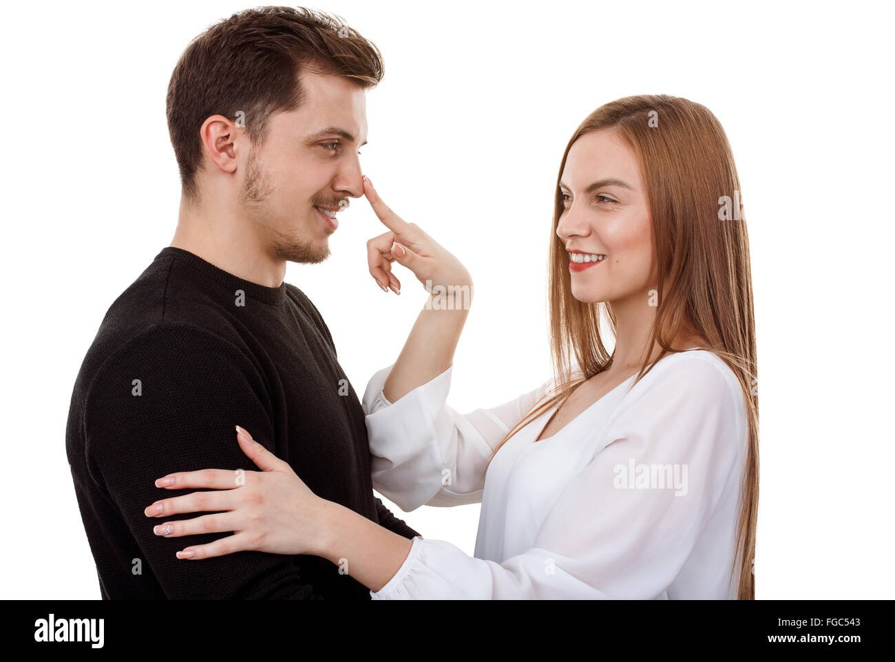 Happy young couple having fun together cutely Stock Photo - Alamy