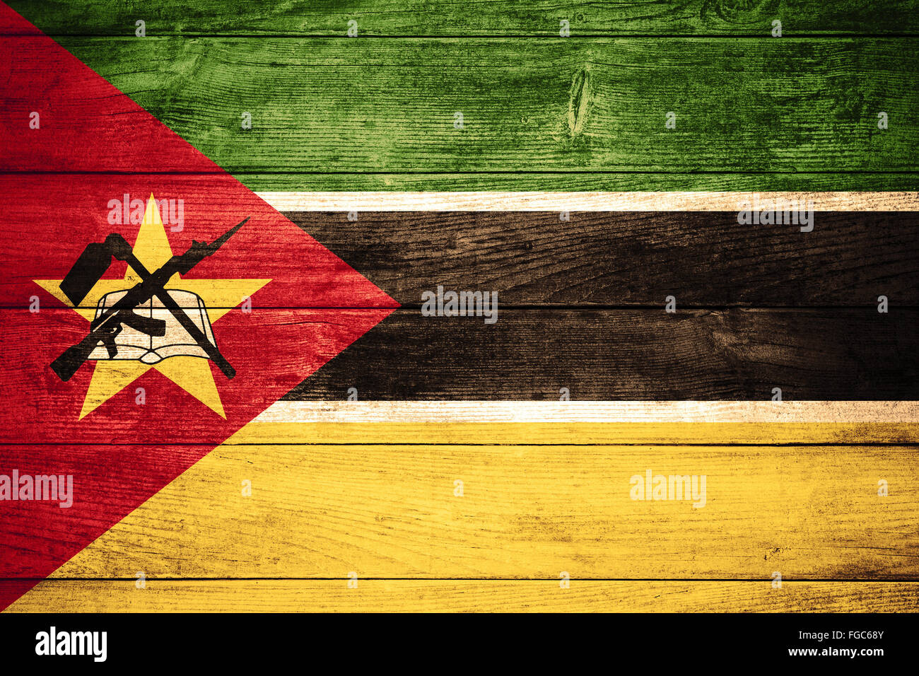 flag of Republic of Mozambique or  banner on wooden background Stock Photo