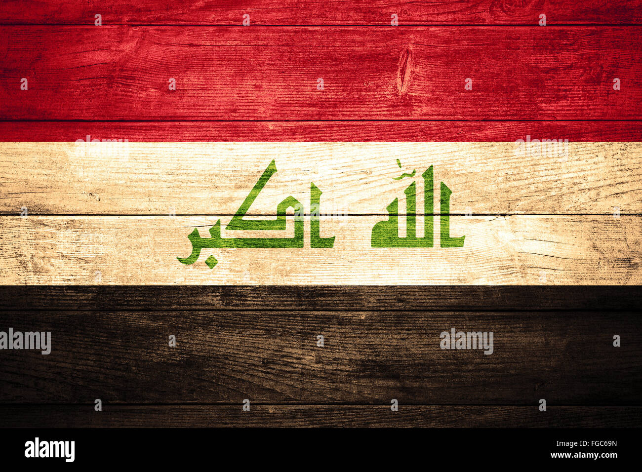 flag of Iraq or  Iraqi banner on wooden background Stock Photo