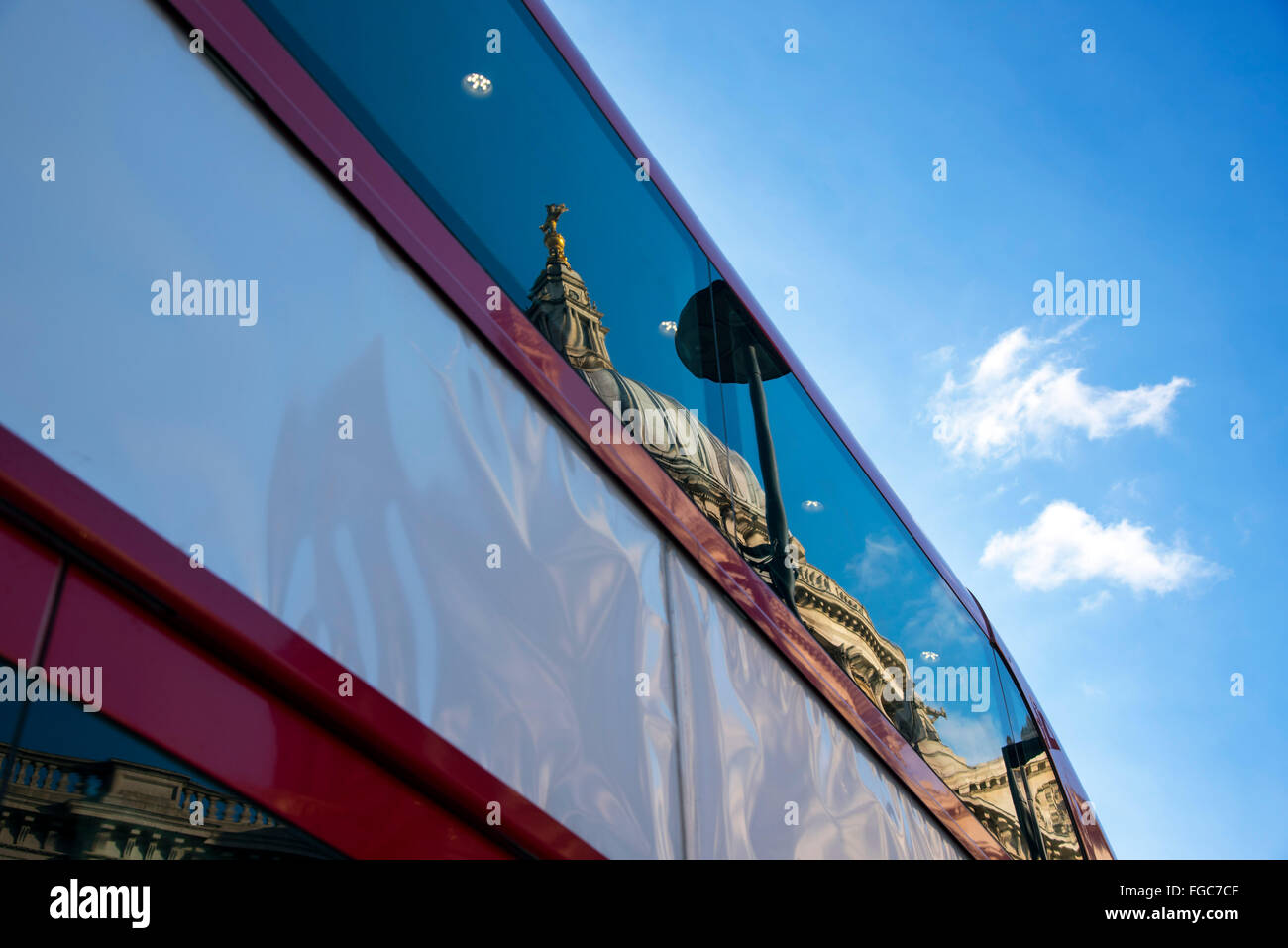 St Paul's Cathedral dome reflection bus side red Stock Photo