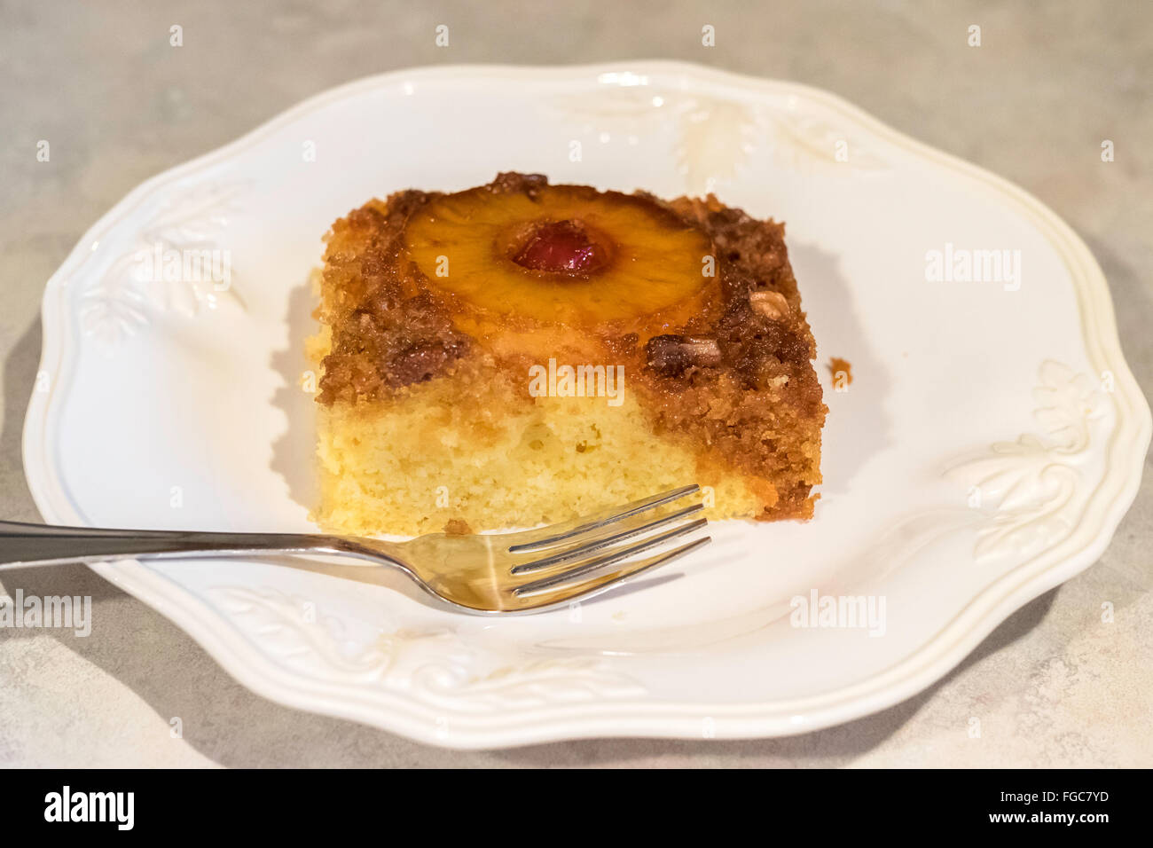 A serving of Pineapple upside down cake, with brown sugar,pineapple