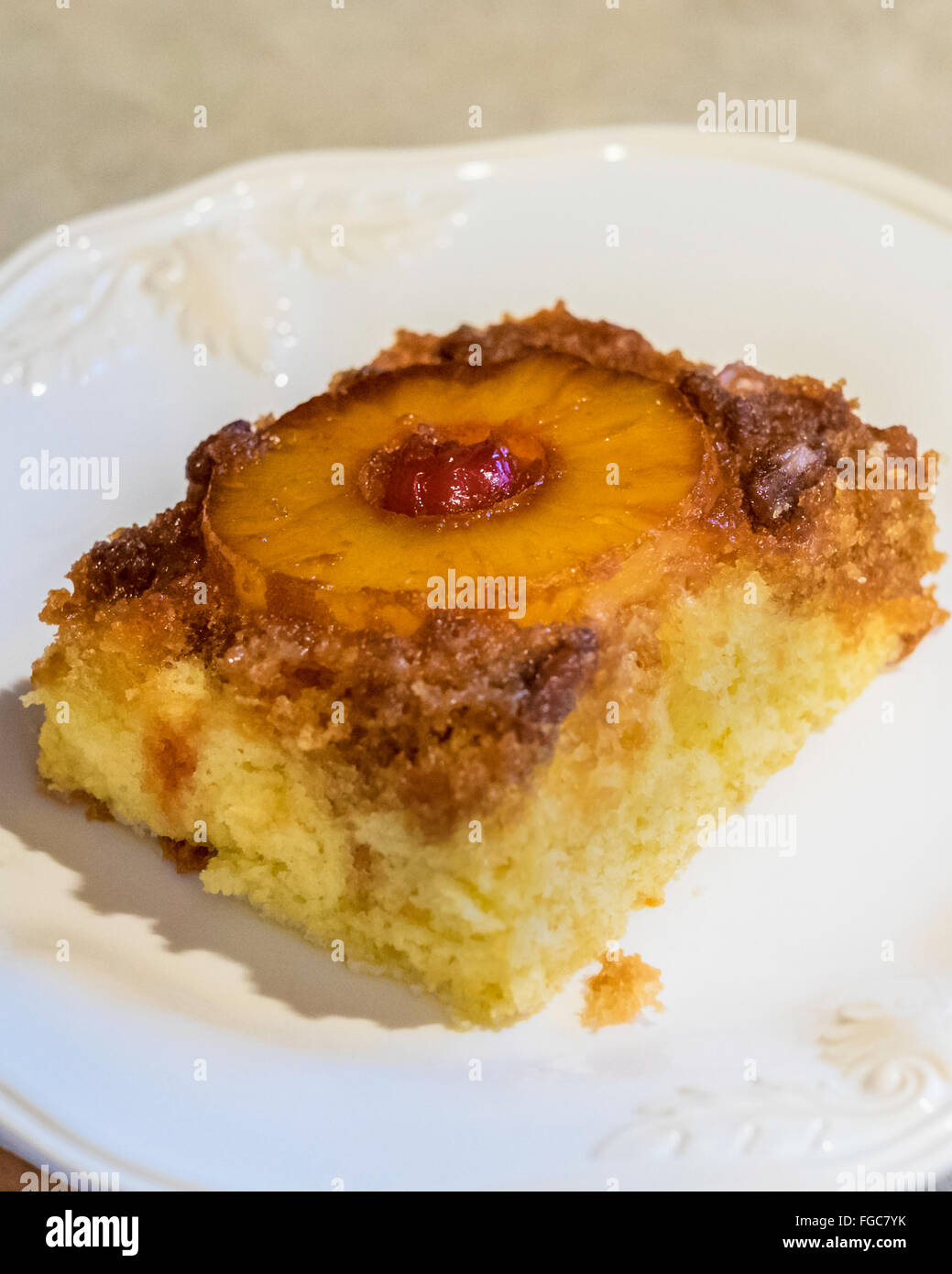 A serving of Pineapple upside down cake, with brown sugar,pineapple