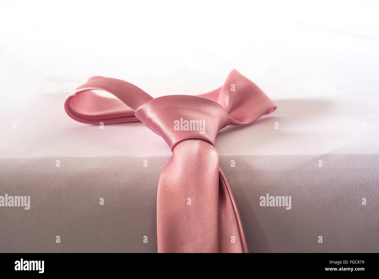 Pink Necktie of Love, Sweet Color on Table Edge Stock Photo