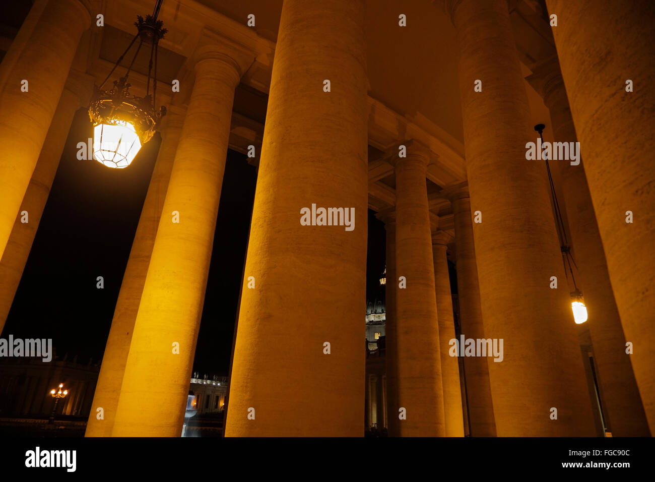 St. Peter's Square colonnades in Rome at night, Vatican Stock Photo