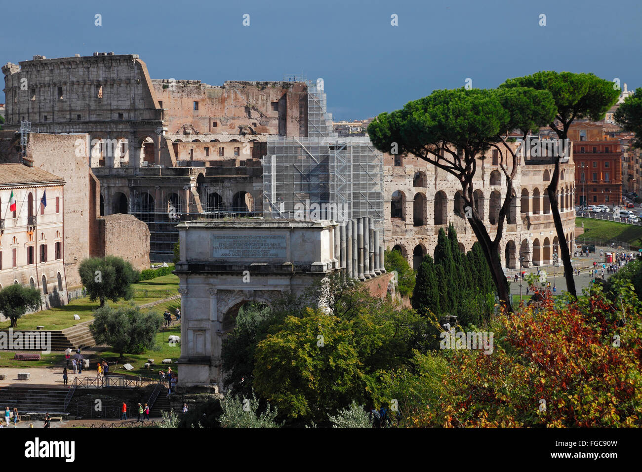 the Colosseum and the Arch of Titus in Rome, Italy Stock Photo