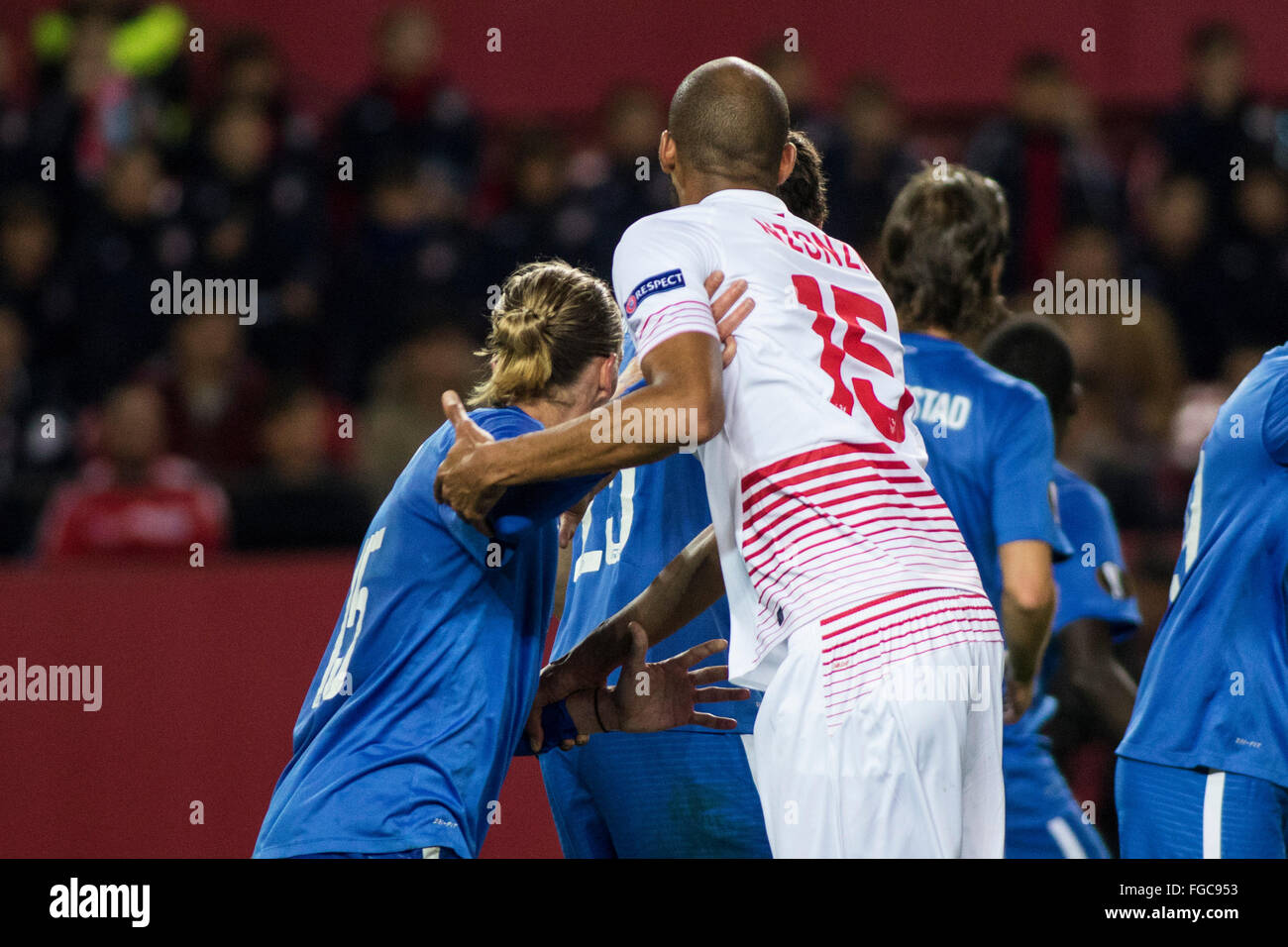 Seville, Spain. 18th February, 2016. Steven N'Zonzi of Sevilla (R ) fights for the ball with Per Egil Flo (L ) during the Europa League match between Sevilla FC and Molde FK at the Ramon Sanchez Pizjuan Stadium  in Seville, Spain, on 18 February, 2016 Credit:  Daniel González Acuña/Alamy Live News Stock Photo