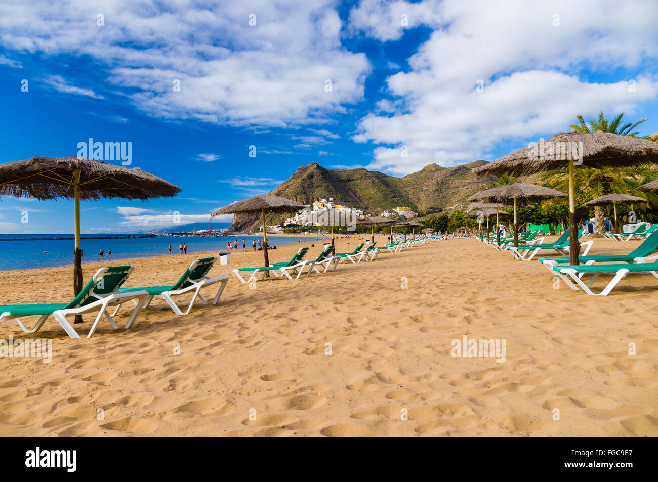 Palapa and chaise-longue on golden sand of Playa de las Teresitas, Tenerife, Spain Stock Photo