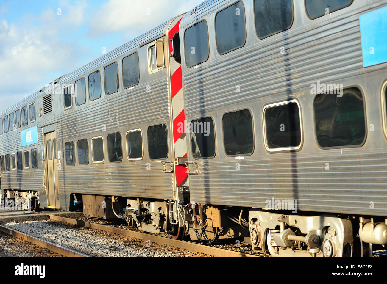 A Metra commuter train departing from the National Street Station in Elgin, Illinois, USA. Stock Photo