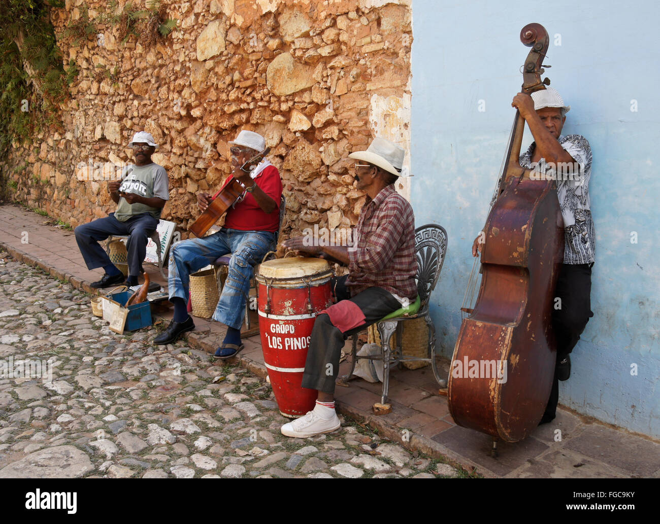 Making music on a cobblestone street, Trinidad, Cuba Stock Photo