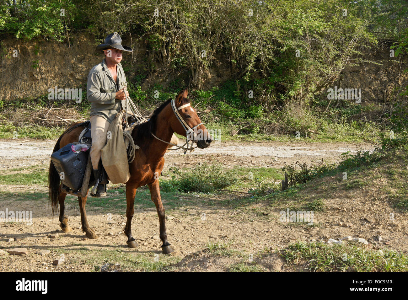 Man riding horse, Valle de los Ingenios (Valley of the Sugar Mills), Trinidad, Cuba Stock Photo