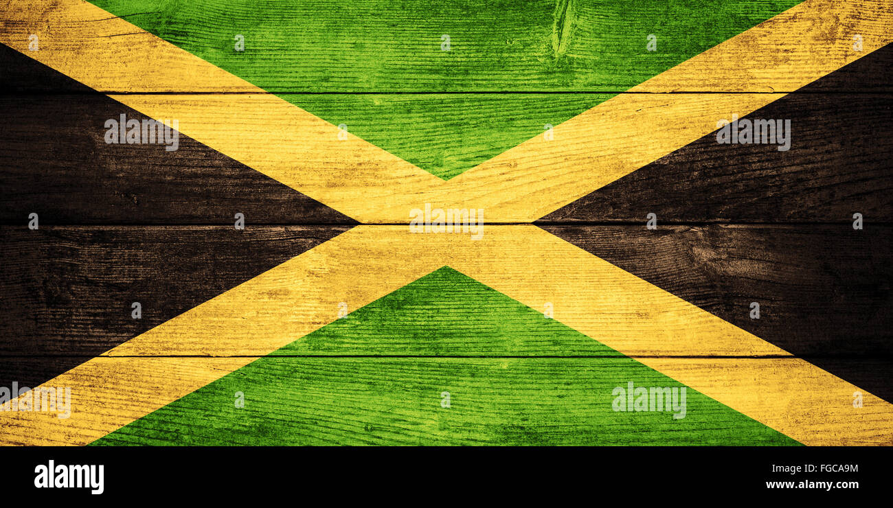 flag of Jamaica or  Jamaican banner on wooden background Stock Photo