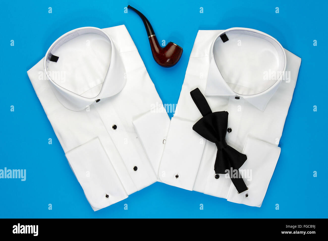 Elegant white shirts for men with black bow tie Stock Photo - Alamy