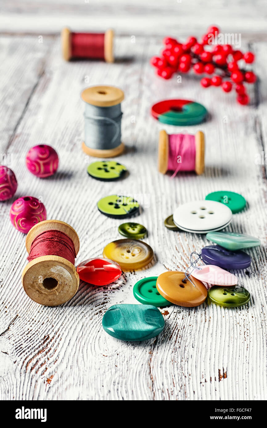Set thread,buttons,beads on the table light vintage Stock Photo - Alamy