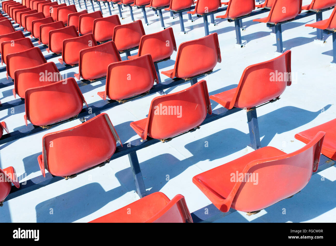 Rows of empty red seats on the upper deck of a passenger ferry Stock Photo