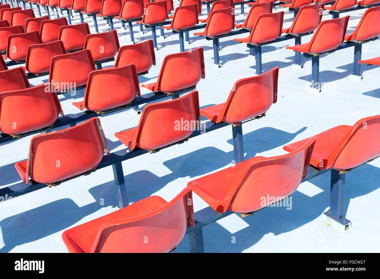 Red seats on the upper deck of a passenger ferry Stock Photo