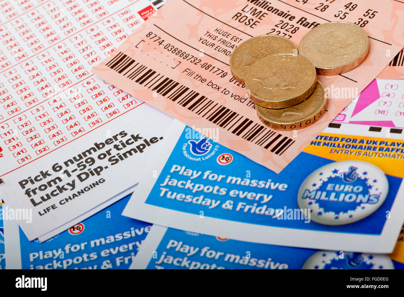 Close up of National Lottery Lotto tickets money and slips ticket slip England UK United Kingdom GB Great Britain Stock Photo