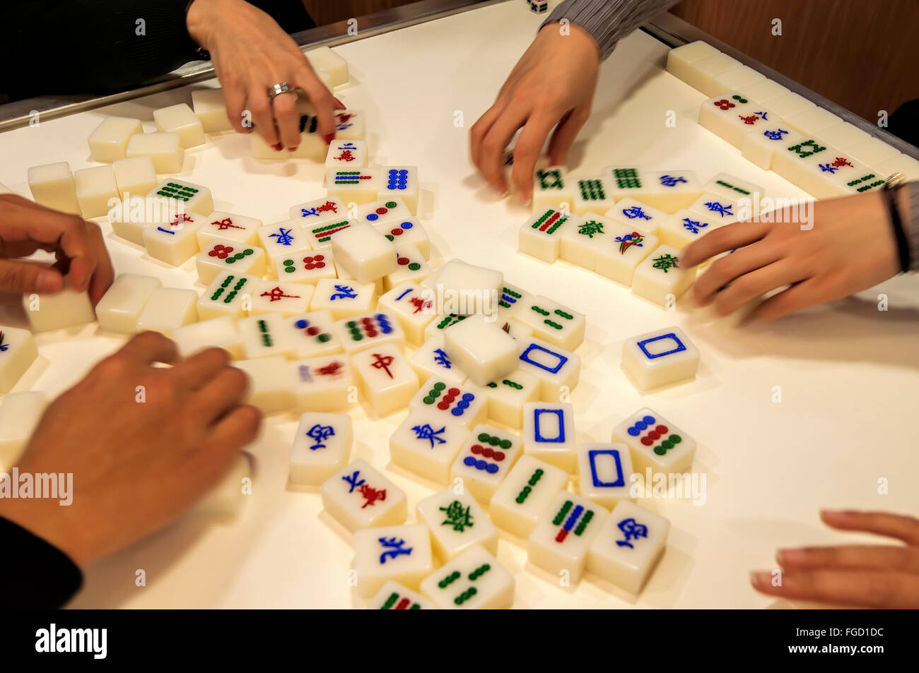People playing Mahjong, Hong Kong, China. Stock Photo