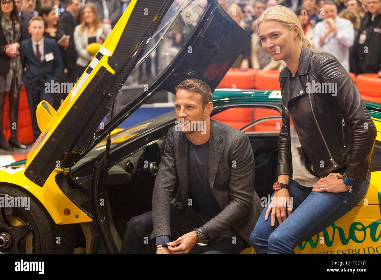 London, UK. 18th February, 2016. Jenson Button is breaking off from his busy preparations for the forthcoming grand prix season to attend the opening night of the London Classic Car Show (18-21 February) at Excel in London’s Docklands. The 2009 Formula One World Champion joins host BBC F1 presenter Suzi Perry, plus top guests from the motor sport and classic car worlds.   The star-studded Preview Evening starts a four-day Great Debate to determine ‘which nation has produced the world’s best cars’. Credit:  Bluefly/Alamy Live News Stock Photo