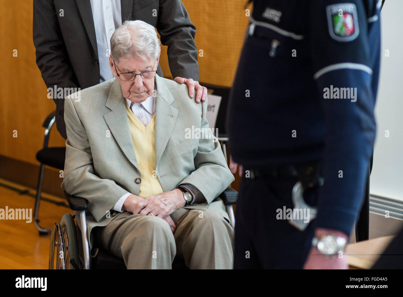 Detmold, Germany. 19th Feb, 2016. Former Auschwitz guard Reinhold Hanning arrives for his trial in Detmold, Germany, 19 February 2016. The 94-year old is accused of accessory to murder in 170,000 cases. The trial lead by the regional court of Detmold takes place at the rooms of the Chamber of Industry and Commerce (IHK) in Detmold. Photo: Bernd Thissen/dpa/Alamy Live News Stock Photo