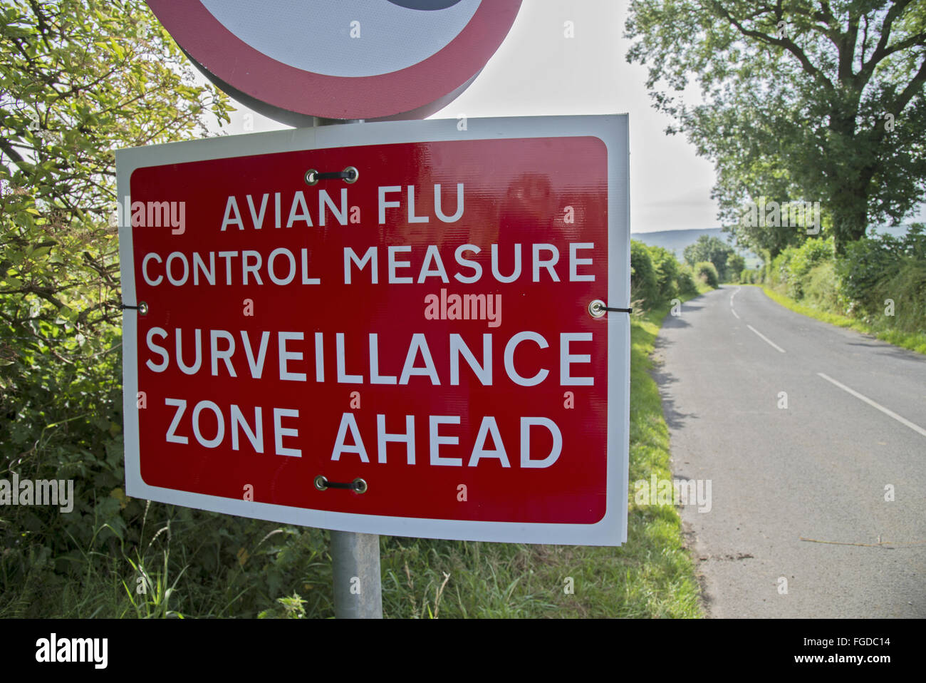 'Avian Flu Control Measure, Surveillance Zone Ahead' sign beside road