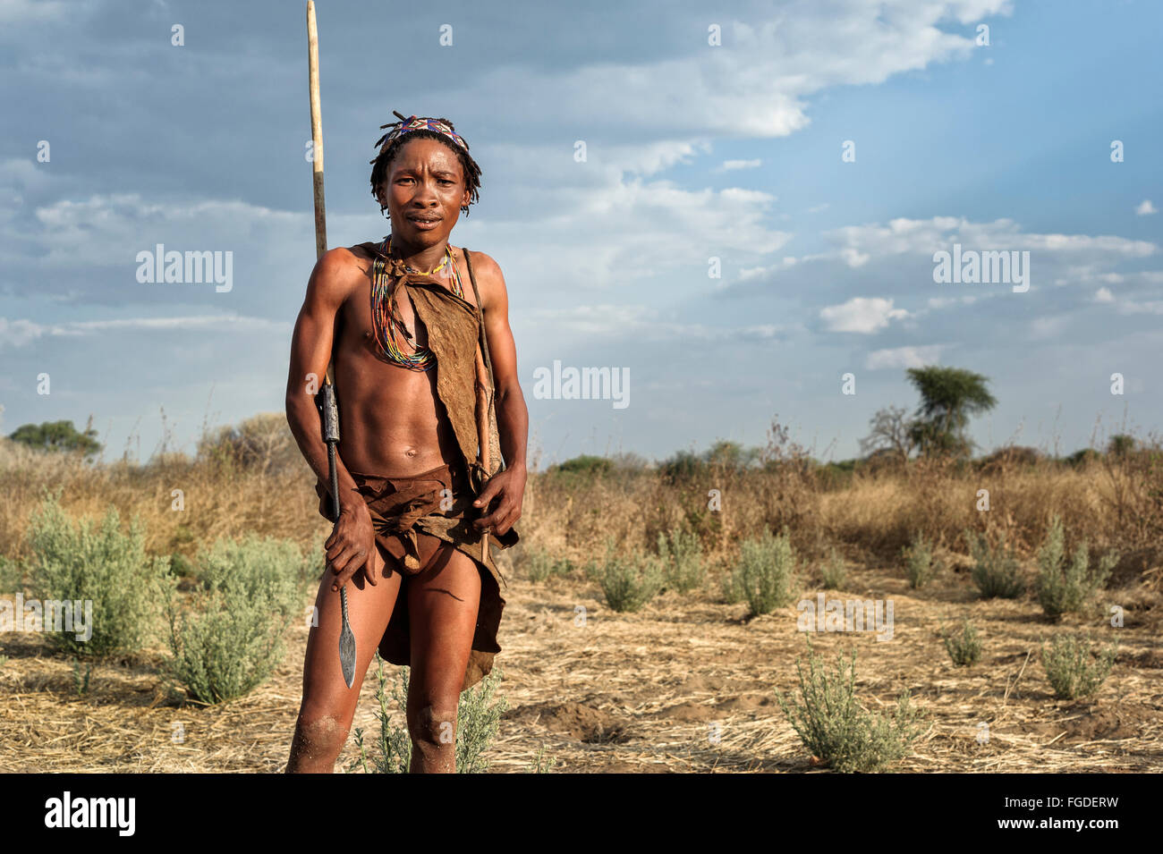 Portrait of a bushmen young men with traditional weapons. Stock Photo