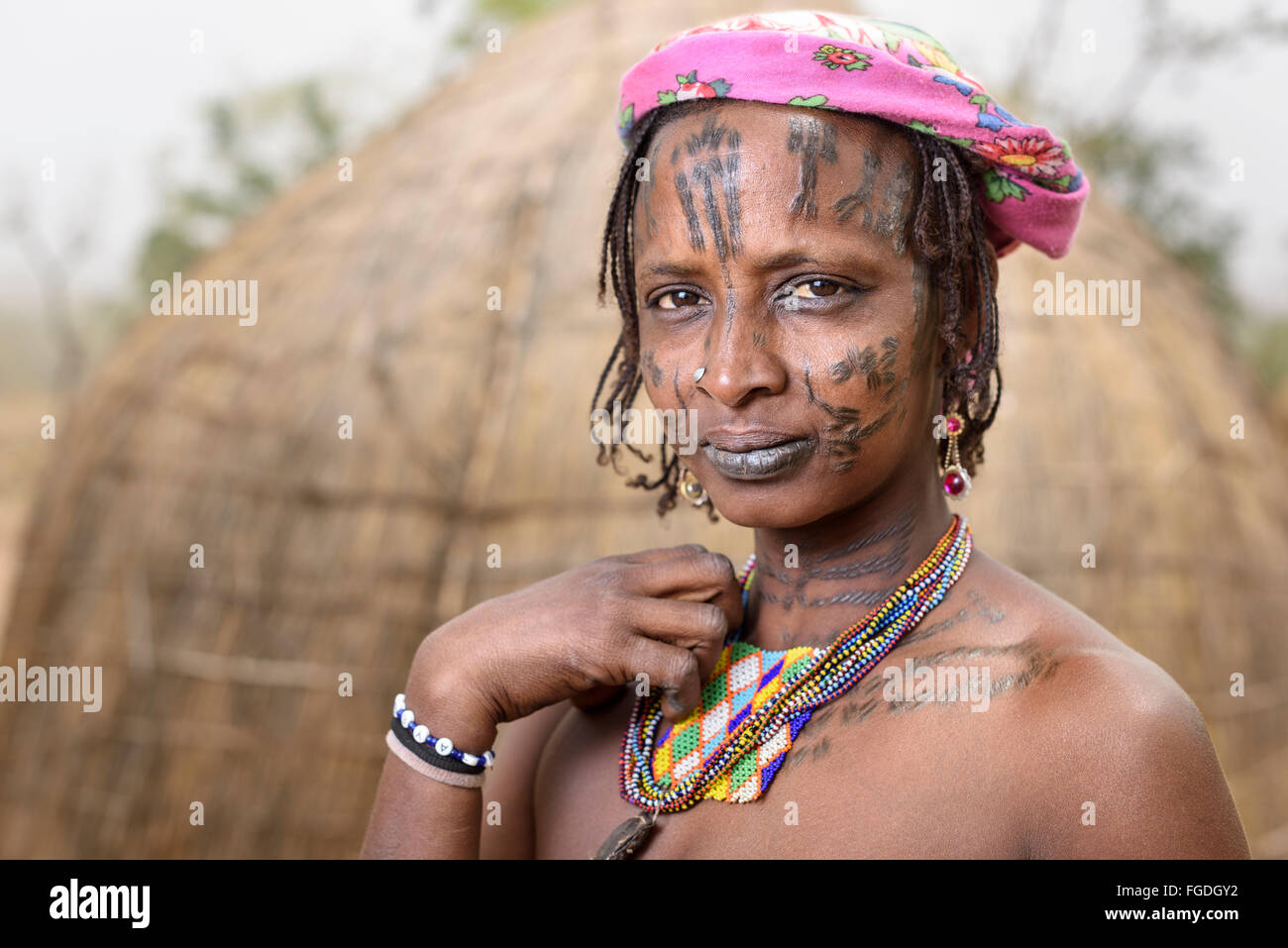 Portrait of a Mbororo woman with the typical scarification on her face. Stock Photo