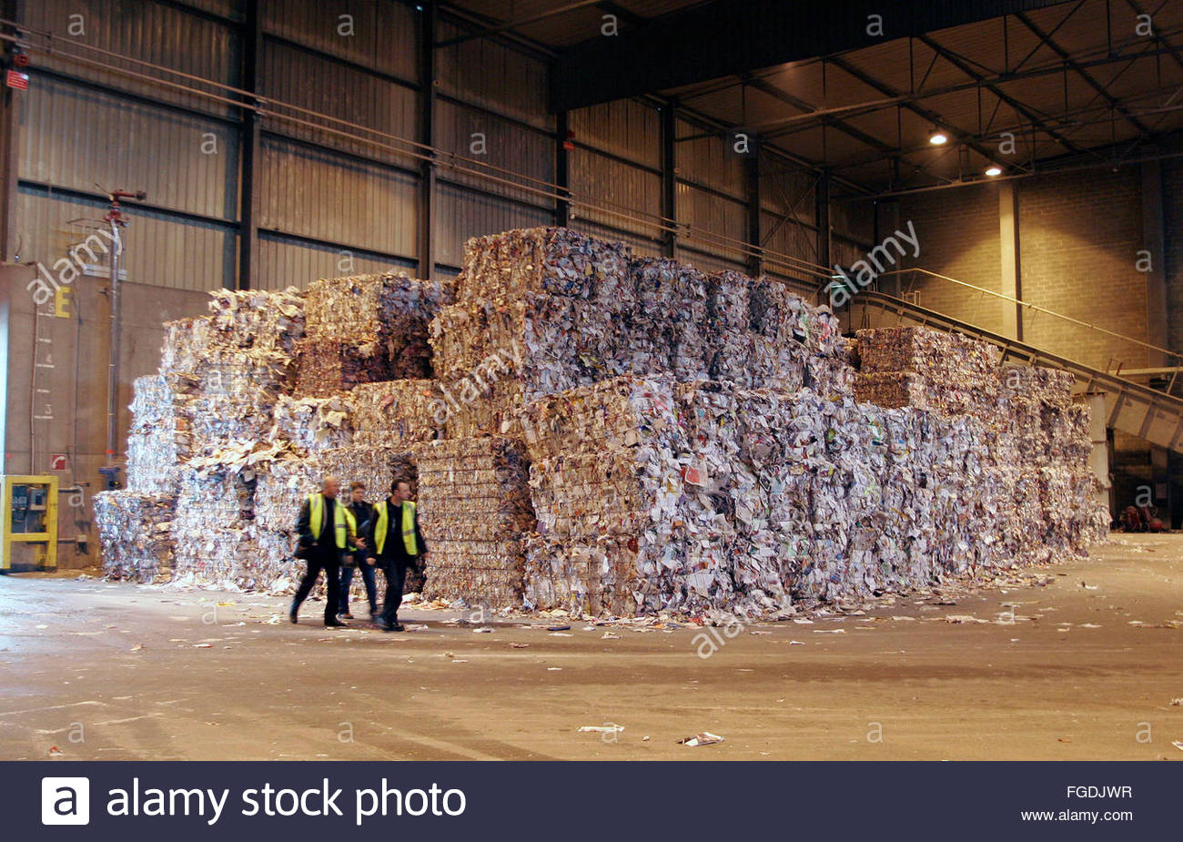 Stacked waste paper bales to be recycled for paper production at the
