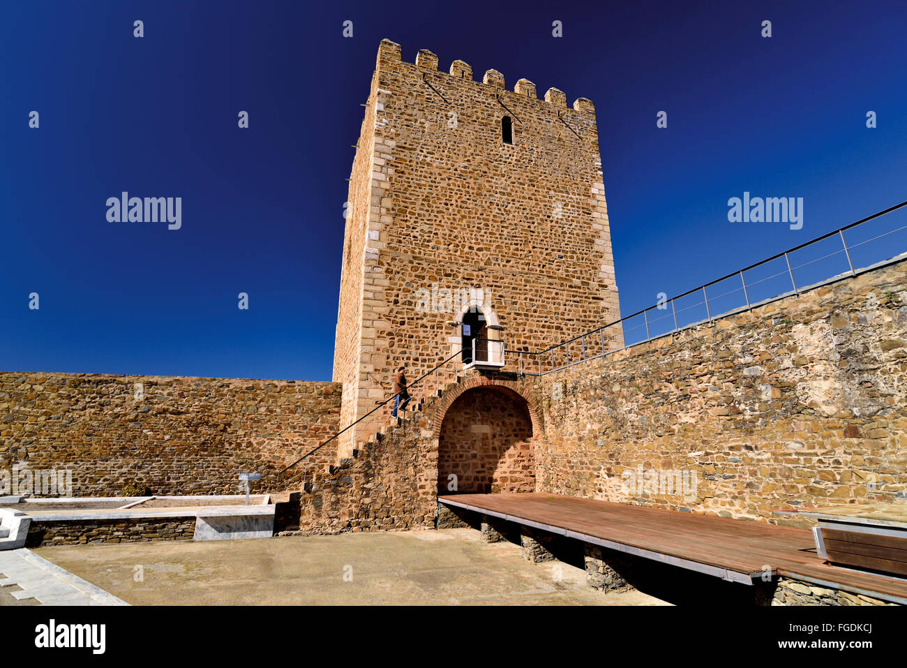 Portugal, Alentejo: Man climbing the steps to the main tower of Mértola Castle Stock Photo