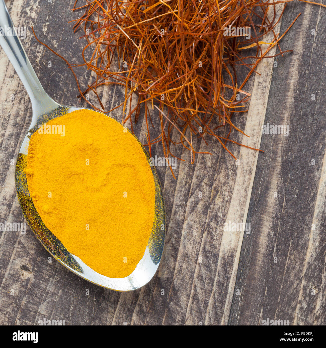 oriental asian indian spices pepper chili saffron strings curcuma on vintage wooden background copyspace Stock Photo
