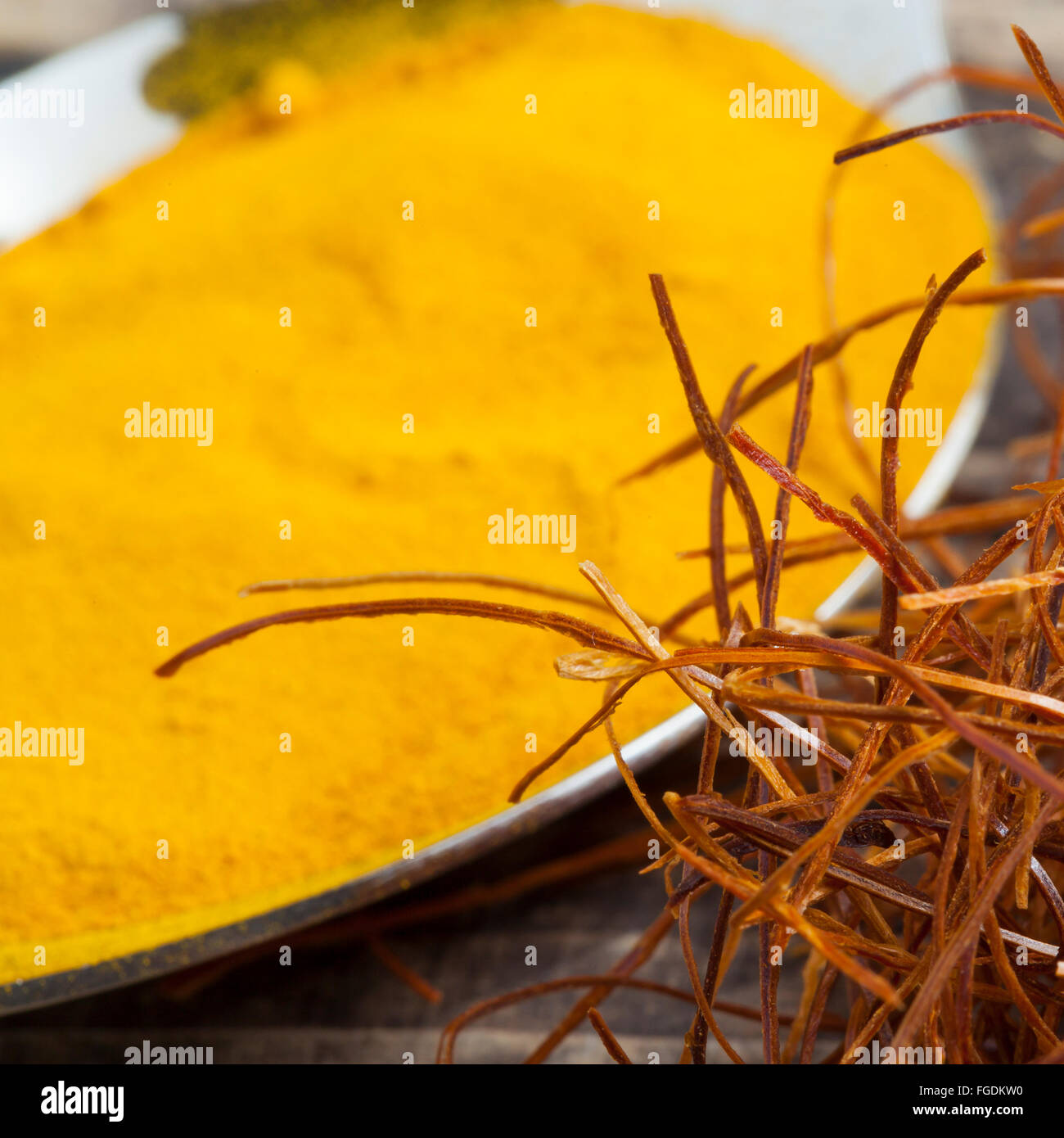 oriental asian indian spices pepper chili saffron strings curcuma on vintage wooden background