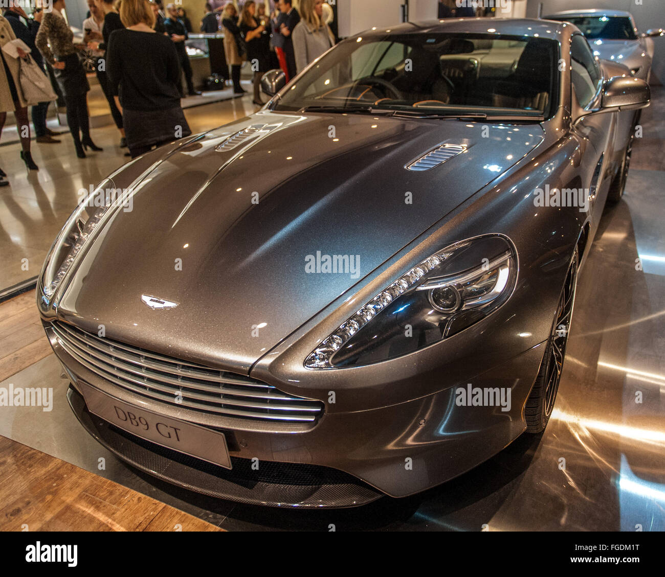 Three Aston Martin sports cars including the DB5 from Goldfinger and the DB10 from Spectre on display in Harrods.  Featuring: Aston Martin DB9 GT Where: London, United Kingdom When: 13 Jan 2016 Stock Photo