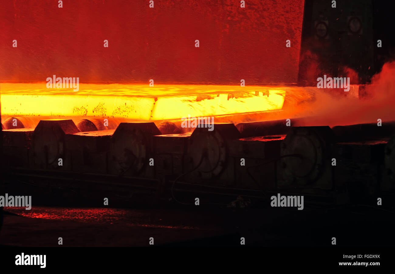 hot steel on conveyor inside of steel plant Stock Photo